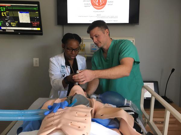 Nursing students learning in the lab.